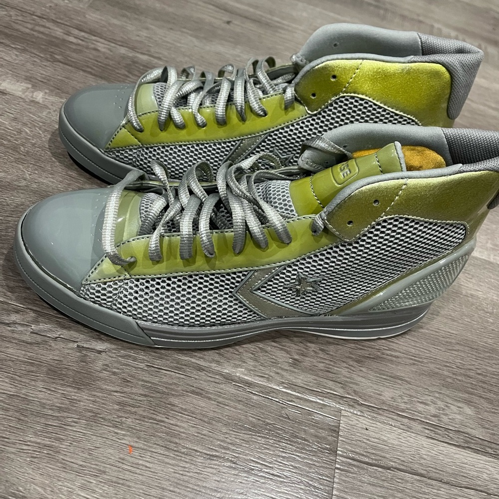 Grey and green converse high top shoes